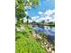 Beautiful waterfront views, palm trees and direct access to the canal and beyond add to this property's appeal at 3456 Highlands Rd, Punta Gorda, FL 33983