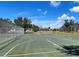 Community basketball court surrounded by a chain link fence at 3512 Nekoosa St, North Port, FL 34287