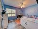 Bright bedroom with a play bed, soft rug, and neutral walls, and a window at 3512 Nekoosa St, North Port, FL 34287