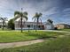 Single-story home featuring a well-manicured lawn and a one-car attached garage at 3512 Nekoosa St, North Port, FL 34287