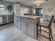 Stylish kitchen featuring a large island with seating, stainless steel appliances, and ample cabinet space at 3512 Nekoosa St, North Port, FL 34287