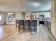Modern kitchen with stainless steel appliances, island with seating, and open layout at 3512 Nekoosa St, North Port, FL 34287