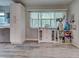 Bright kitchen area with gray floors, lots of storage space, and large windows at 3512 Nekoosa St, North Port, FL 34287
