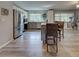 Updated kitchen with stainless steel appliances, island seating, and hardwood floors at 3512 Nekoosa St, North Port, FL 34287