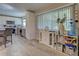 Bright kitchen with stainless appliances, gray floors, and large windows for natural light at 3512 Nekoosa St, North Port, FL 34287