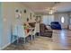 Open living area with dining table, hardwood floors, and a ceiling fan at 3512 Nekoosa St, North Port, FL 34287