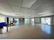 Large meeting room with tile floor and walls of windows, looking out onto a pool and seating areas at 3512 Nekoosa St, North Port, FL 34287