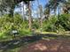 Picturesque nature trail surrounded by lush greenery and informative signs, inviting exploration and appreciation of the natural environment at 3512 Nekoosa St, North Port, FL 34287