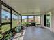 Enclosed patio with grill, plants, and outdoor space, great for entertaining at 3512 Nekoosa St, North Port, FL 34287