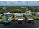 Aerial view showcases a waterfront property with a screened-in pool and canal access at 4051 Rock Creek Dr, Port Charlotte, FL 33948