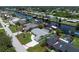 Aerial view showcases a single-Gathering home on a canal with boat dock at 4051 Rock Creek Dr, Port Charlotte, FL 33948