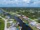 A waterfront property featuring private dock access to the Gulf, a pool, and beautifully landscaped backyard at 4051 Rock Creek Dr, Port Charlotte, FL 33948