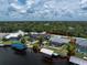Waterfront home featuring a screened pool, canal access, and proximity to boating and recreational opportunities at 4051 Rock Creek Dr, Port Charlotte, FL 33948