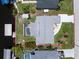 Aerial view of home showcasing backyard pool, boat dock, and overall layout of the property and neighboring houses at 4051 Rock Creek Dr, Port Charlotte, FL 33948