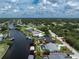 Aerial view features home's access to both community streets and direct access to the canal at 4051 Rock Creek Dr, Port Charlotte, FL 33948