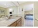 Granite counters and ample cabinet space enhance this bathroom connected to the main bedroom at 4051 Rock Creek Dr, Port Charlotte, FL 33948