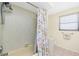 Well-lit shower and vanity with under-mount sink and granite counters are bathroom highlights at 4051 Rock Creek Dr, Port Charlotte, FL 33948