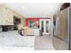 Well-equipped kitchen with stainless steel appliances, granite countertops, and tile flooring at 4051 Rock Creek Dr, Port Charlotte, FL 33948