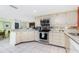 Well-appointed kitchen with stainless steel appliances and tile flooring, perfect for cooking and entertaining at 4051 Rock Creek Dr, Port Charlotte, FL 33948
