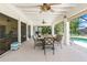 The screened-in lanai has dining table and chairs and plenty of room for entertaining at 4051 Rock Creek Dr, Port Charlotte, FL 33948