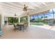 The lanai features a dining table and chairs and a view of the waterfront pool at 4051 Rock Creek Dr, Port Charlotte, FL 33948
