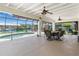 The screen-enclosed lanai features a kidney shaped pool with a waterfront view at 4051 Rock Creek Dr, Port Charlotte, FL 33948