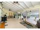 Large sunroom with multiple seating areas, ceiling fans, and direct access to an outdoor pool at 4051 Rock Creek Dr, Port Charlotte, FL 33948
