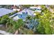 Beautiful view of property displaying metal roof, lush palm trees, and manicured lawn at 415 W Marion Ave, Punta Gorda, FL 33950