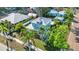 Property features a mix of green trees and palm trees to create a relaxing atmosphere at 415 W Marion Ave, Punta Gorda, FL 33950