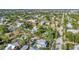 Expansive aerial view showcases a neighborhood near the bay, with well-maintained properties and lush landscaping at 415 W Marion Ave, Punta Gorda, FL 33950