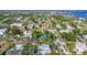 Picturesque aerial view showcases homes near the bay, complemented by a neighborhood with lush landscaping at 415 W Marion Ave, Punta Gorda, FL 33950
