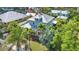 Lush tropical landscaping surrounds the property, enhancing privacy and natural beauty at 415 W Marion Ave, Punta Gorda, FL 33950