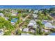 Scenic aerial view showcases a charming home near the bay, featuring a private pool and outbuilding at 415 W Marion Ave, Punta Gorda, FL 33950
