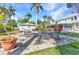 Outdoor patio area with elegant furniture, perfect for gatherings and enjoying the beautiful surroundings at 415 W Marion Ave, Punta Gorda, FL 33950