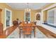 Dining room featuring a chandelier, hardwood floors, and natural light at 415 W Marion Ave, Punta Gorda, FL 33950