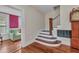 Inviting entryway featuring hardwood floors, staircase, and living room view at 415 W Marion Ave, Punta Gorda, FL 33950