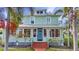 Charming two-story home featuring a brick walkway, beautiful landscaping, and a welcoming front entrance at 415 W Marion Ave, Punta Gorda, FL 33950