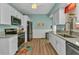 Updated kitchen with stainless steel appliances, granite countertops, and a modern design at 415 W Marion Ave, Punta Gorda, FL 33950