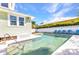 Enjoy a refreshing dip in this inviting pool, framed by a lovely backyard and a charming home at 415 W Marion Ave, Punta Gorda, FL 33950