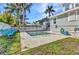 Relaxing pool area with manicured lawn, perfect for outdoor enjoyment and leisure at 415 W Marion Ave, Punta Gorda, FL 33950