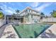 Beautiful backyard pool area, perfect for relaxation and entertaining near the screened-in porch at 415 W Marion Ave, Punta Gorda, FL 33950