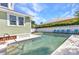 Enjoy a refreshing dip in this inviting pool, framed by a lovely backyard and a charming home at 415 W Marion Ave, Punta Gorda, FL 33950
