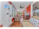 Bright sunroom featuring hardwood floors, multiple windows, and a seating area with a dining set at 415 W Marion Ave, Punta Gorda, FL 33950
