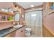 Charming bathroom with unique lighting, a stylish vanity, and a shower featuring a decorative curtain at 457 Glenridge Nw Ave, Port Charlotte, FL 33952