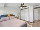 Bright bedroom featuring a modern bed, closet, ample natural light, and warm tones at 457 Glenridge Nw Ave, Port Charlotte, FL 33952
