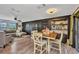 Dining area showcases a wooden table with seating, complemented by stylish decor and an open floor plan at 457 Glenridge Nw Ave, Port Charlotte, FL 33952