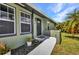 Charming single-story home with a well-maintained lawn and walkway leading to the front entrance at 457 Glenridge Nw Ave, Port Charlotte, FL 33952