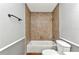 Well-lit bathroom with a tiled shower-tub and coordinated fixtures at 496 Fletcher St, Port Charlotte, FL 33954