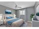 Cozy bedroom with gray walls, plush carpeting, and minimalist decor at 496 Fletcher St, Port Charlotte, FL 33954