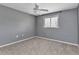 Neutral bedroom with a ceiling fan, window and carpet at 496 Fletcher St, Port Charlotte, FL 33954